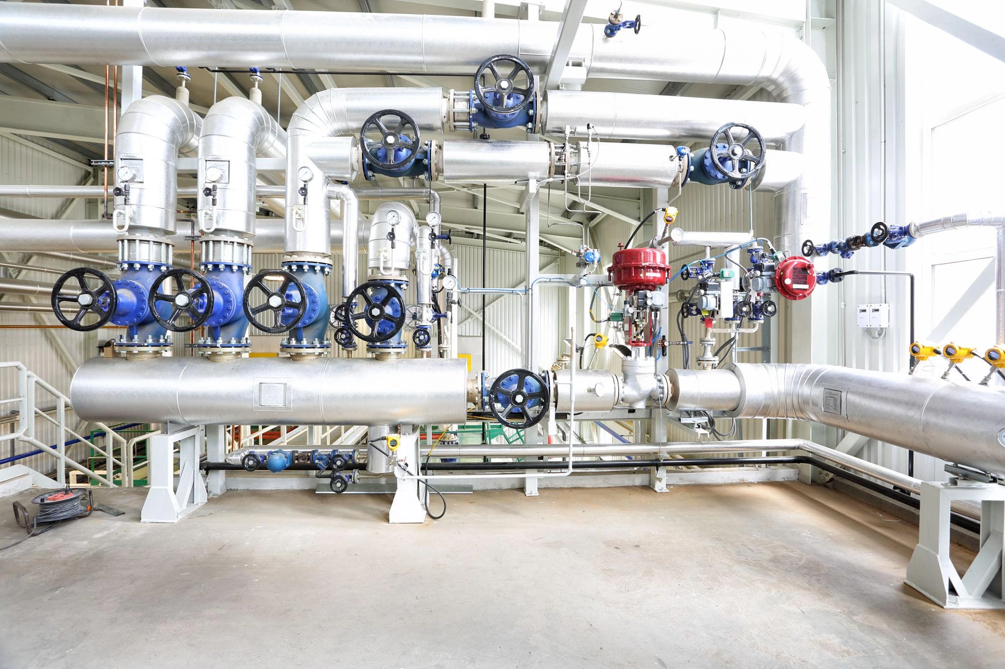 Boiler house and plant utilities served by feed and circulation pumps.